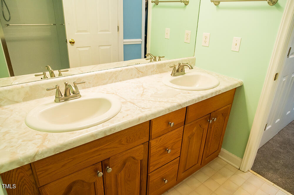 46 Beaver Crossing Road Roxboro, NC 27574 - Photo 24 of 50 a bathroom with a sink and a mirror