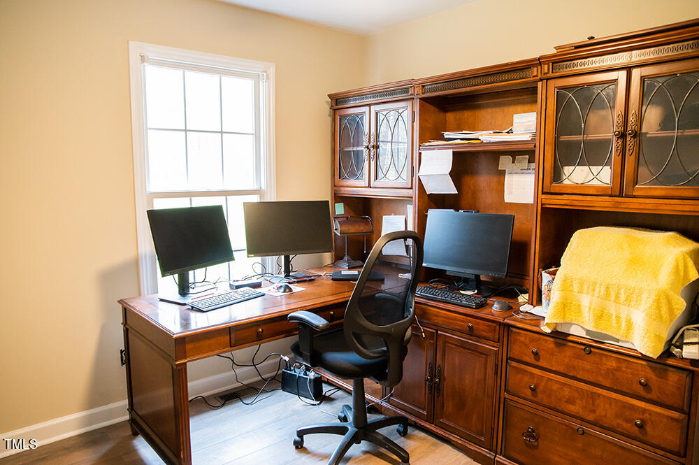 46 Beaver Crossing Road Roxboro, NC 27574 - Photo 29 of 50 a view of a workspace with furniture and a window