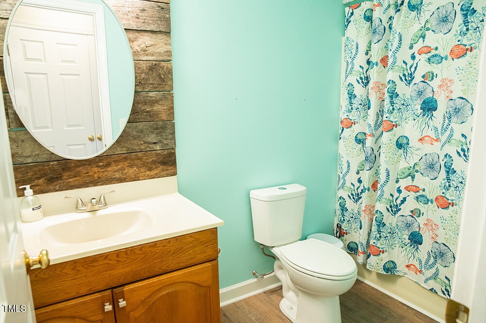 46 Beaver Crossing Road Roxboro, NC 27574 - Photo 31 of 50 a bathroom with a sink and a mirror