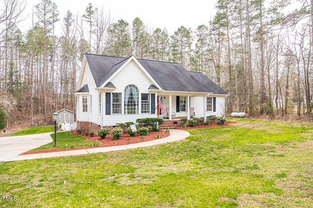 46 Beaver Crossing Road Roxboro, NC 27574 - Photo 34 of 50 a front view of a house with swimming pool and sitting area