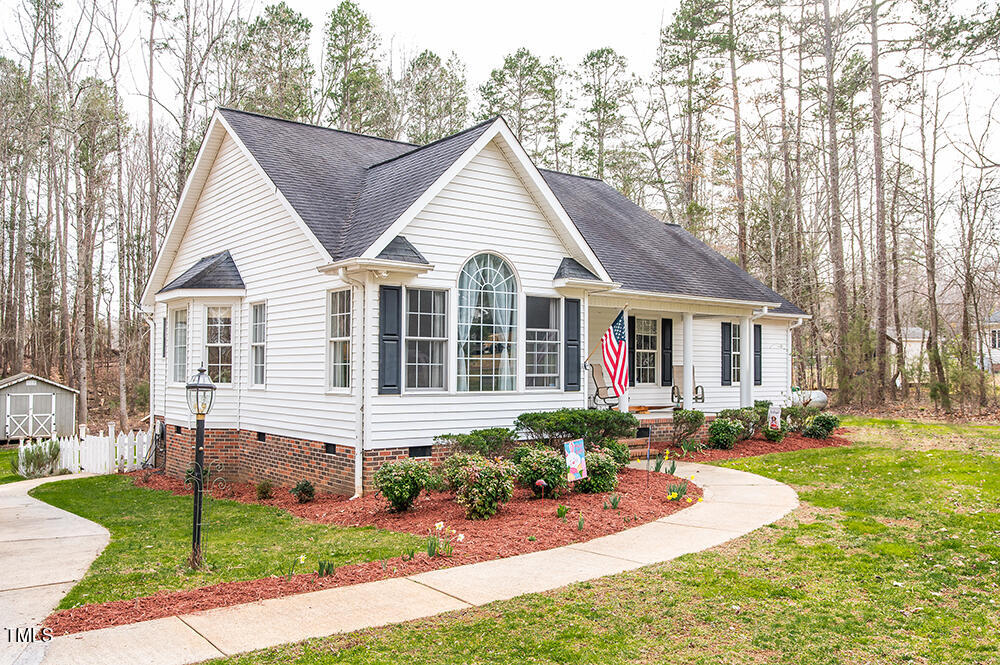 46 Beaver Crossing Road Roxboro, NC 27574 - Photo 35 of 50 a front view of a house with a yard and porch