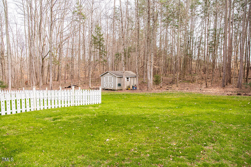 46 Beaver Crossing Road Roxboro, NC 27574 - Photo 39 of 50 a view of a garden with large trees