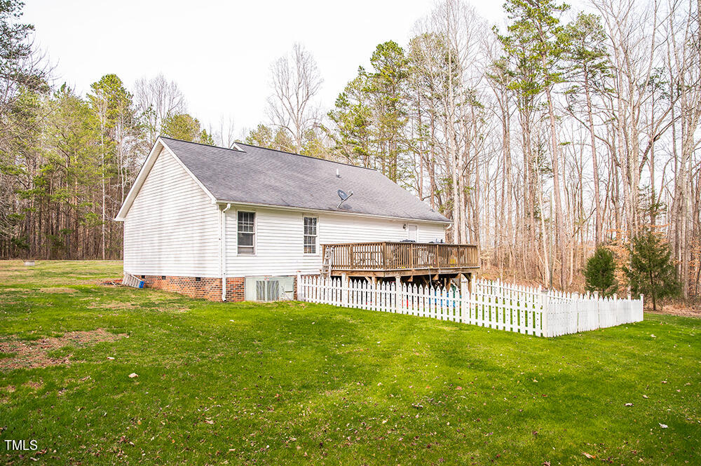46 Beaver Crossing Road Roxboro, NC 27574 - Photo 41 of 50 a view of a house with a backyard and a tree