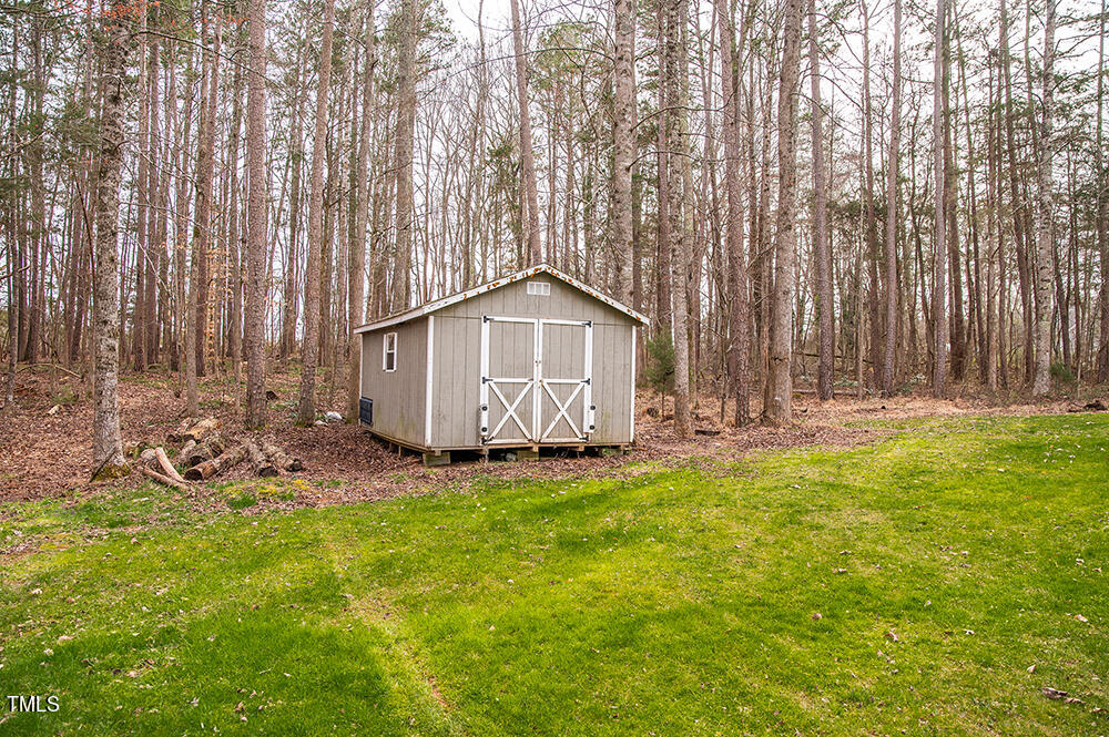 46 Beaver Crossing Road Roxboro, NC 27574 - Photo 43 of 50 a view of a house with backyard and garden