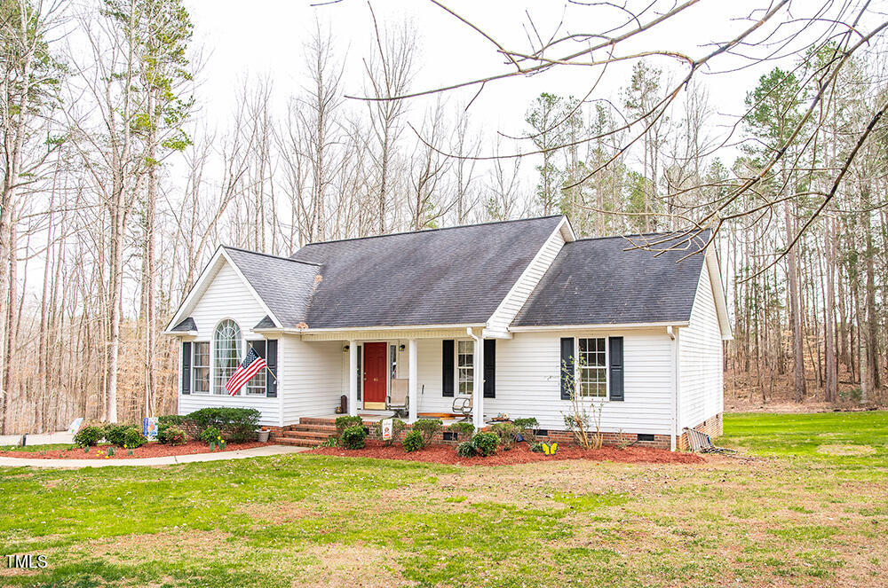 46 Beaver Crossing Road Roxboro, NC 27574 - Photo 47 of 50 a front view of a house with a yard and trees