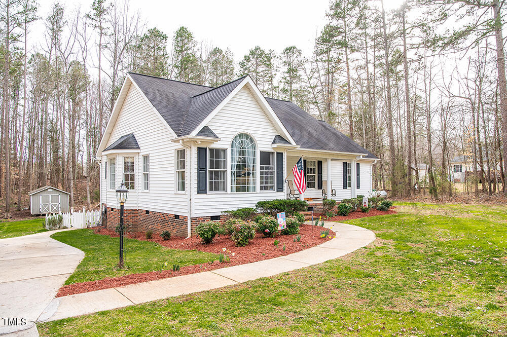 46 Beaver Crossing Road Roxboro, NC 27574 - Photo 48 of 50 a view of a house with a yard and plants
