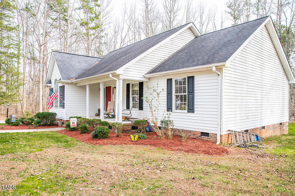 46 Beaver Crossing Road Roxboro, NC 27574 - Photo 49 of 50 a backyard of a house with seating space