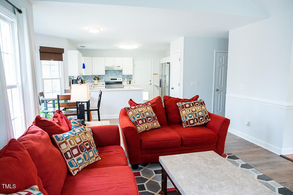 46 Beaver Crossing Road Roxboro, NC 27574 - Photo 6 of 50 a living room with furniture a rug and kitchen view