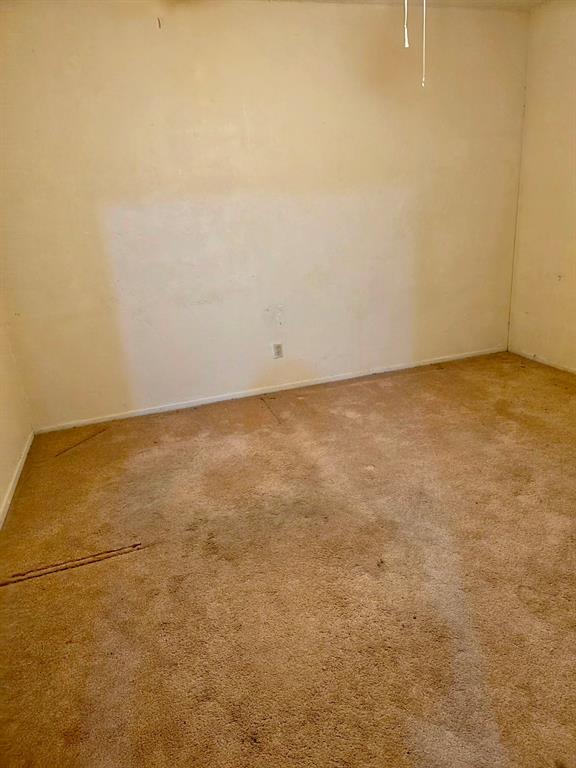 922 Fannin Street, Unit 102 Denton, TX 76201 - Photo 9 of 9 View of carpeted empty room