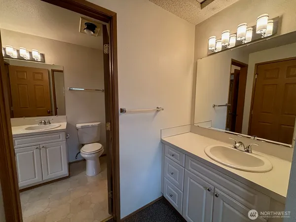 an empty room with closet area