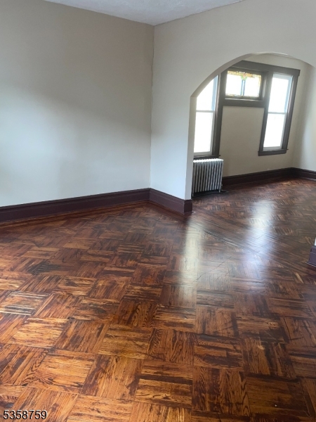 32 Underwood Street, Unit 1 Newark, NJ 07106 - Photo 3 of 8 an empty room with wooden floor and windows