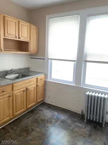 a room with cabinets and a window