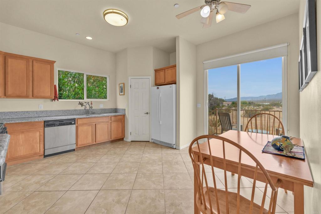 3431 Santa Saba Road Borrego Springs, CA 92004 - Photo 11 of 23 a view of a kitchen with a sink and dishwasher with a fireplace