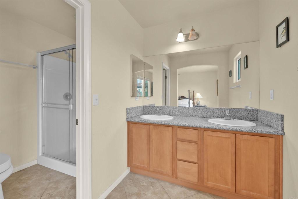 3431 Santa Saba Road Borrego Springs, CA 92004 - Photo 17 of 23 a bathroom with a granite countertop sink and a mirror
