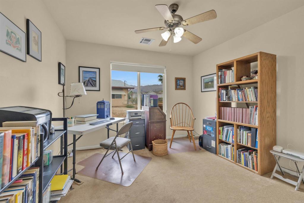 3431 Santa Saba Road Borrego Springs, CA 92004 - Photo 20 of 23 a view of a livingroom with furniture and bookshelf