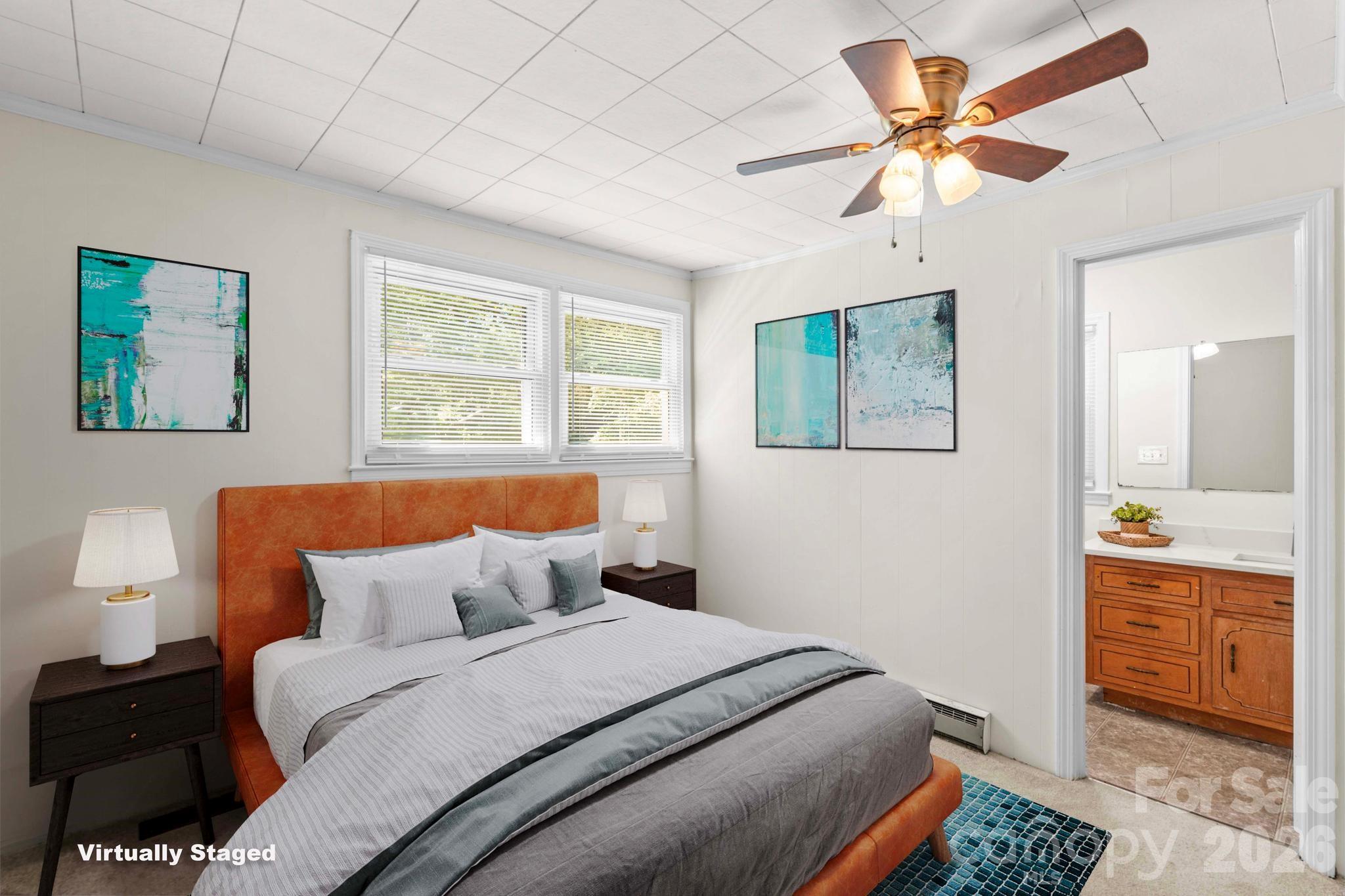 835 Maple Avenue Salisbury, NC 28144 - Photo 19 of 48 a bedroom with a bed and a chandelier