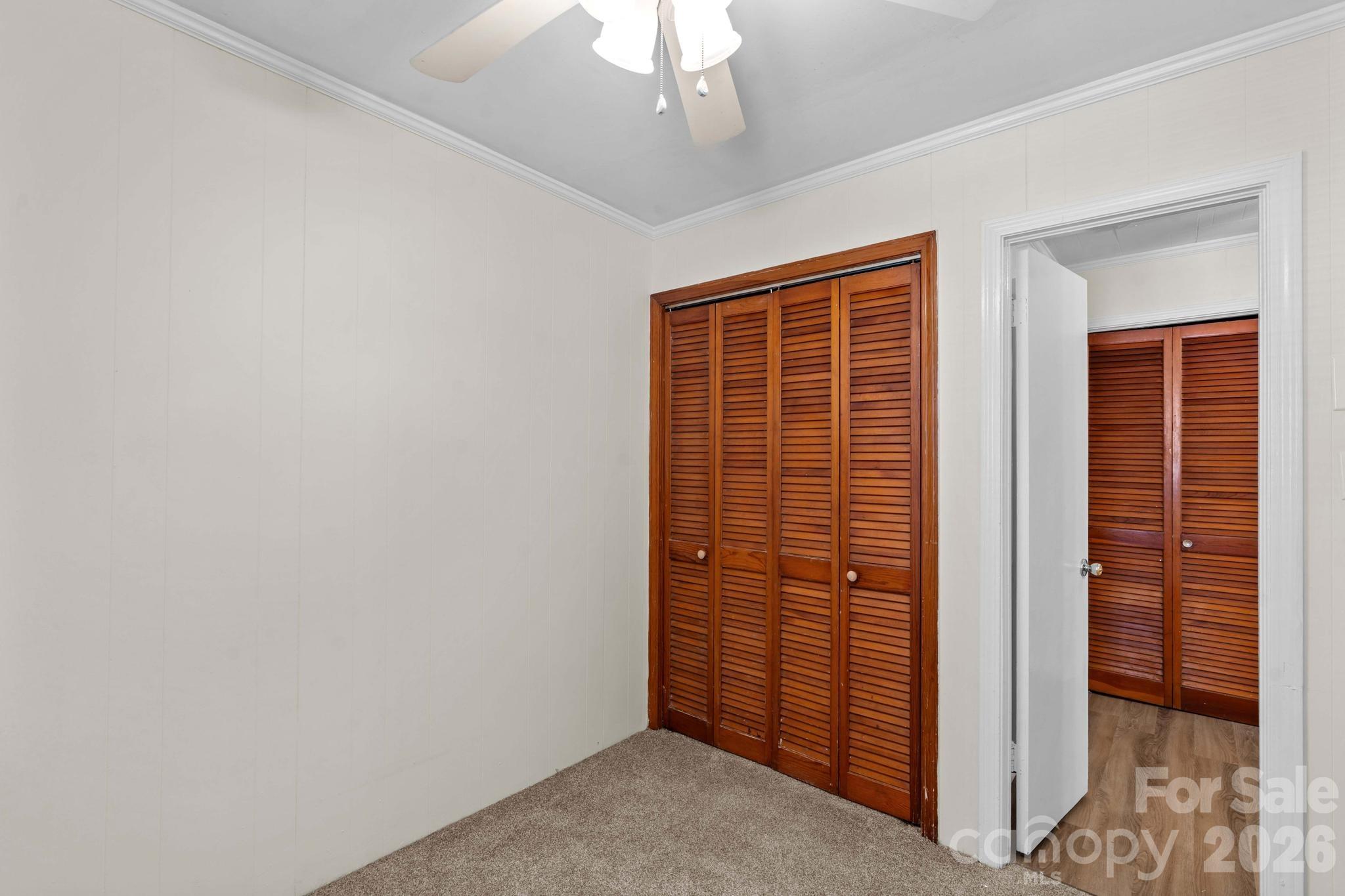 835 Maple Avenue Salisbury, NC 28144 - Photo 28 of 48 an empty room with wooden floor and windows
