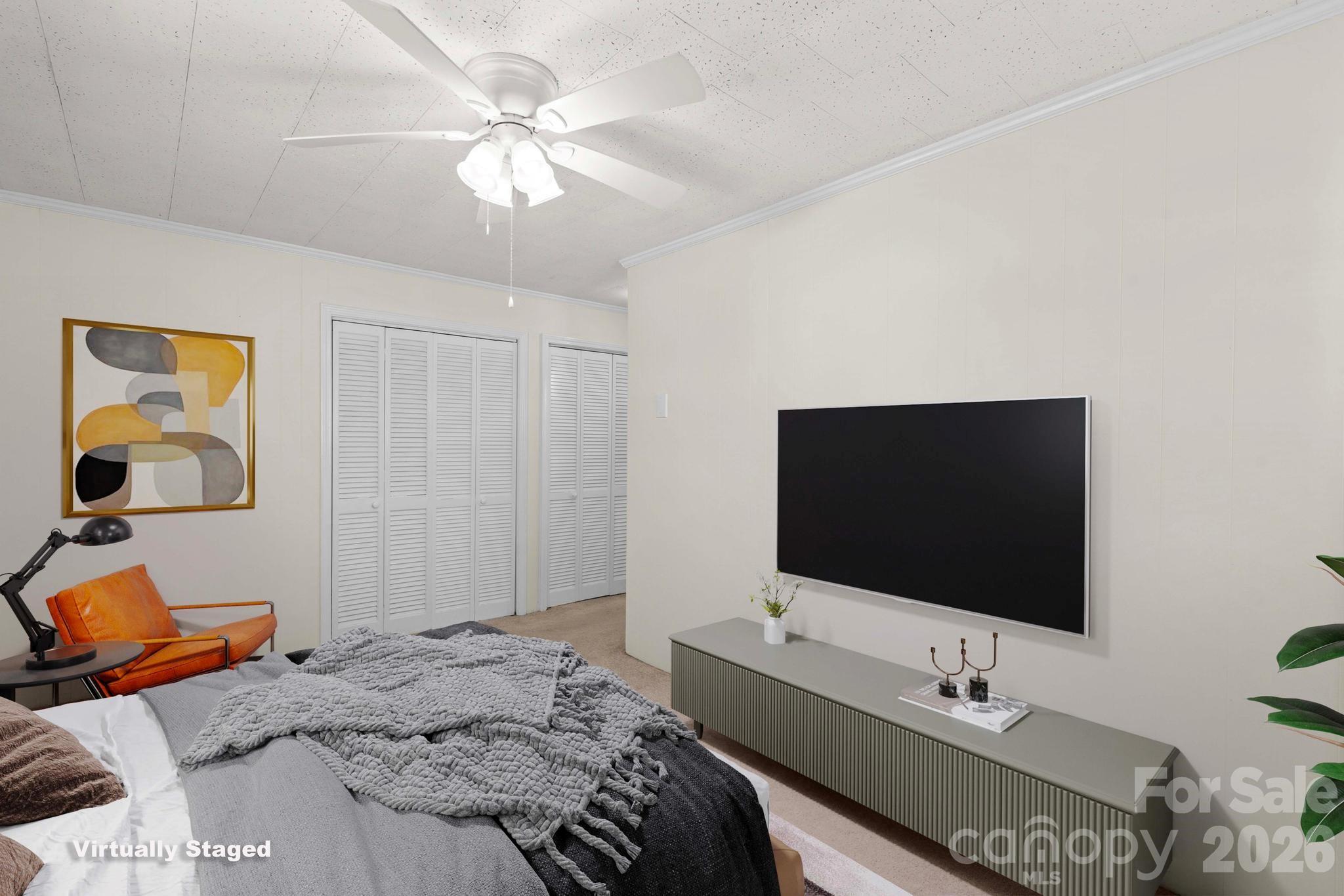 835 Maple Avenue Salisbury, NC 28144 - Photo 33 of 48 a bedroom with a bed and a flat screen tv