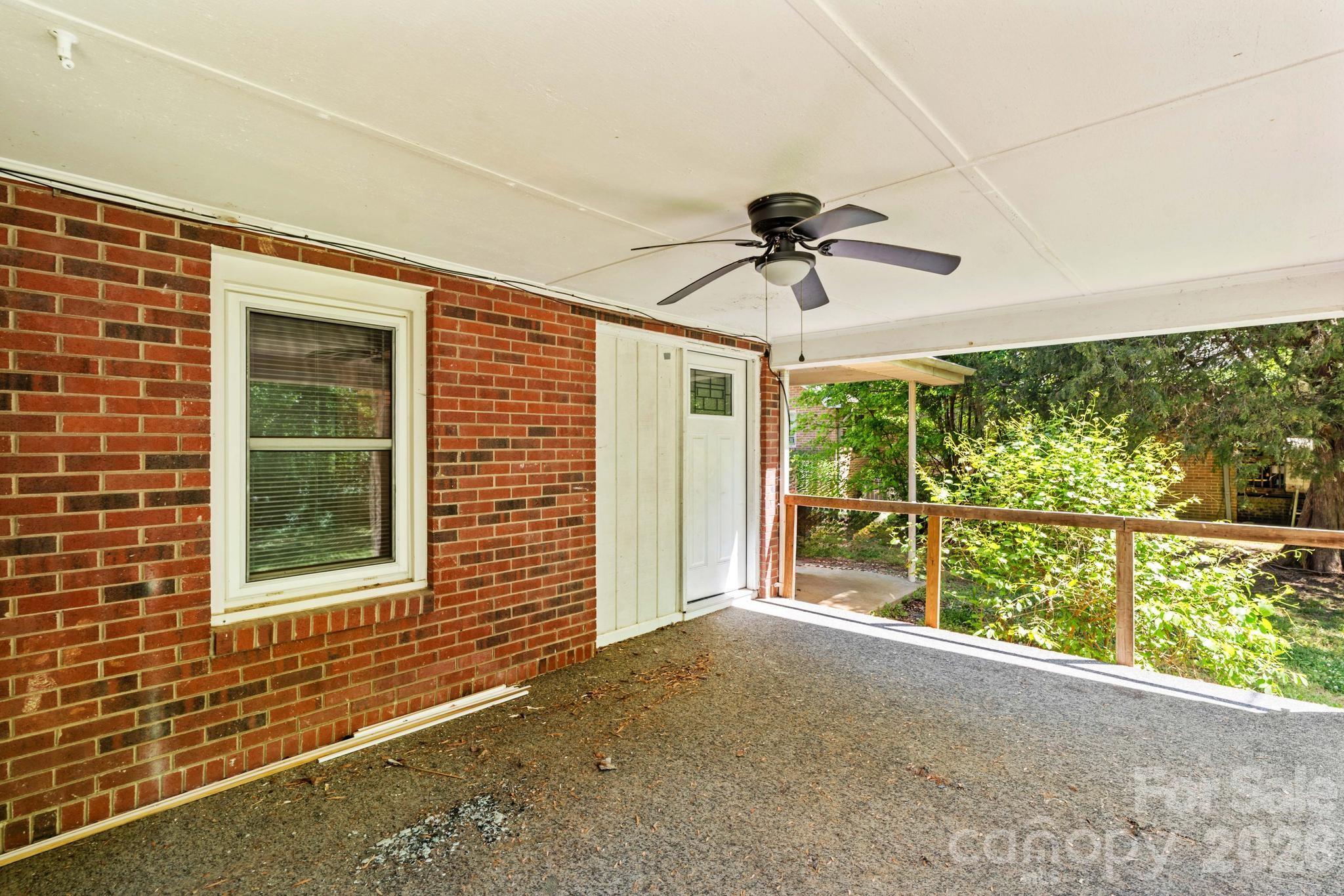 835 Maple Avenue Salisbury, NC 28144 - Photo 38 of 48 a view of a livingroom with a ceiling fan and a large window
