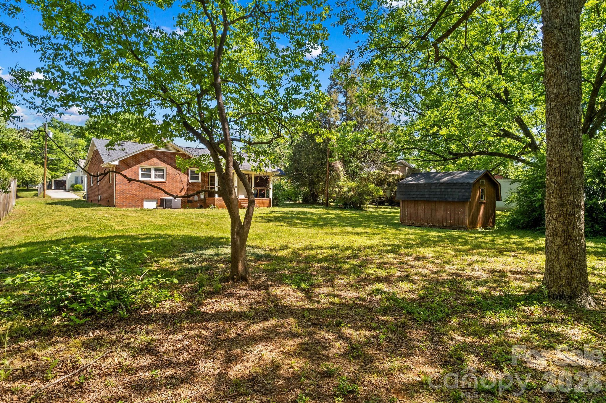 835 Maple Avenue Salisbury, NC 28144 - Photo 46 of 48 a view of a garden with a tree