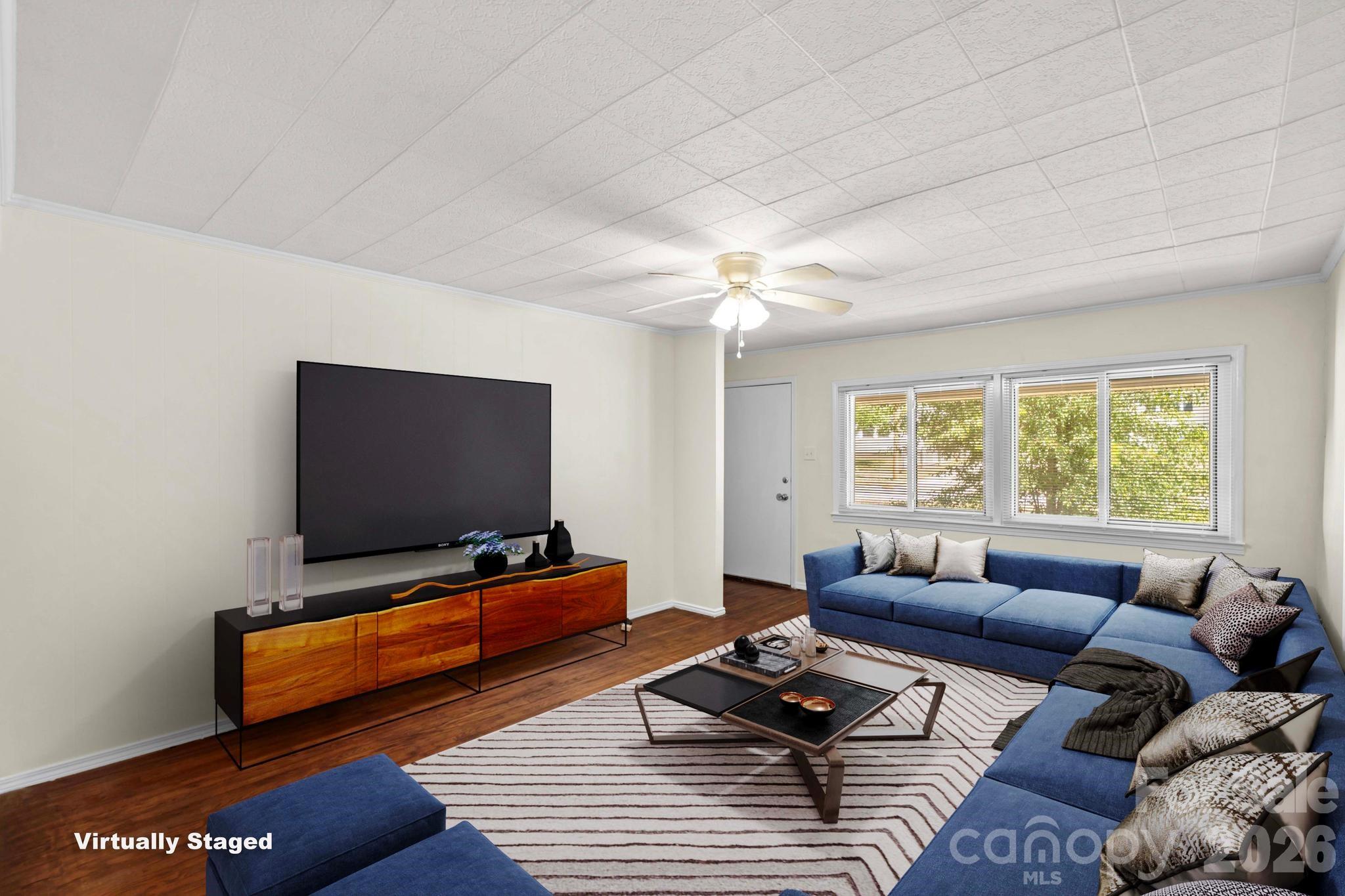 835 Maple Avenue Salisbury, NC 28144 - Photo 5 of 48 a living room with furniture and a flat screen tv