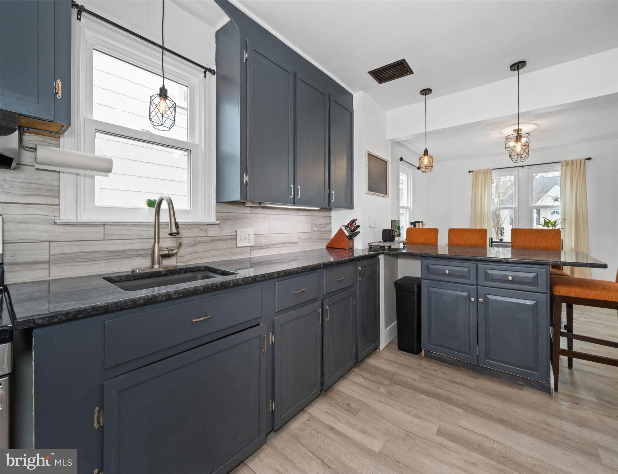 7 2nd Avenue New Castle, DE 19720 - Photo 22 of 44 Modern kitchen with sleek cabinetry and light.