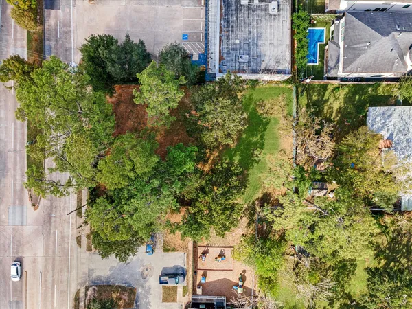 an aerial view of a houses with yard