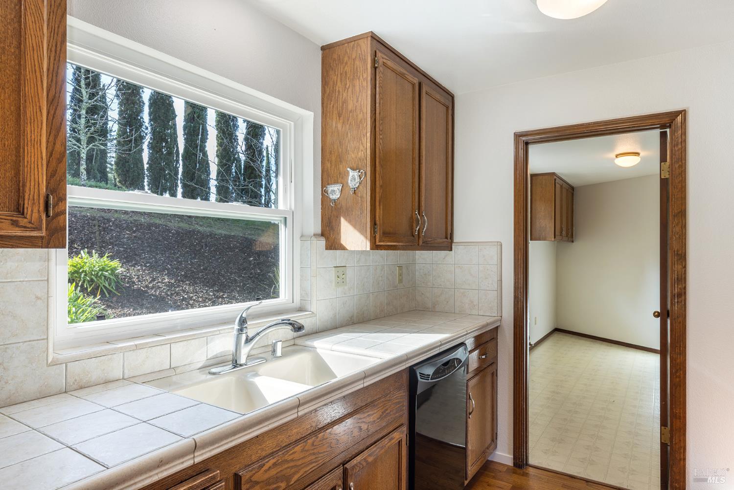 324 Burgundy Road Healdsburg, CA 95448 - Photo 20 of 52 Tons of natural light comes in the kitchen window.