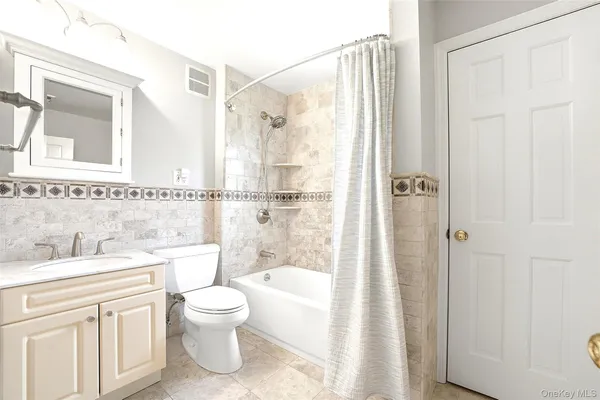 a bathroom with a toilet a sink and a bathtub