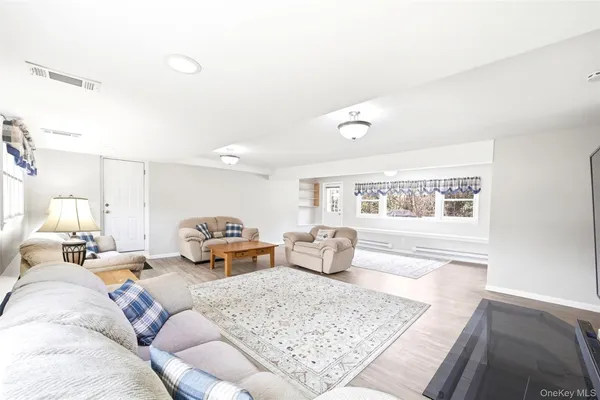 a living room with furniture and a window