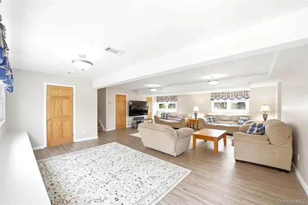 a living room with furniture and a rug