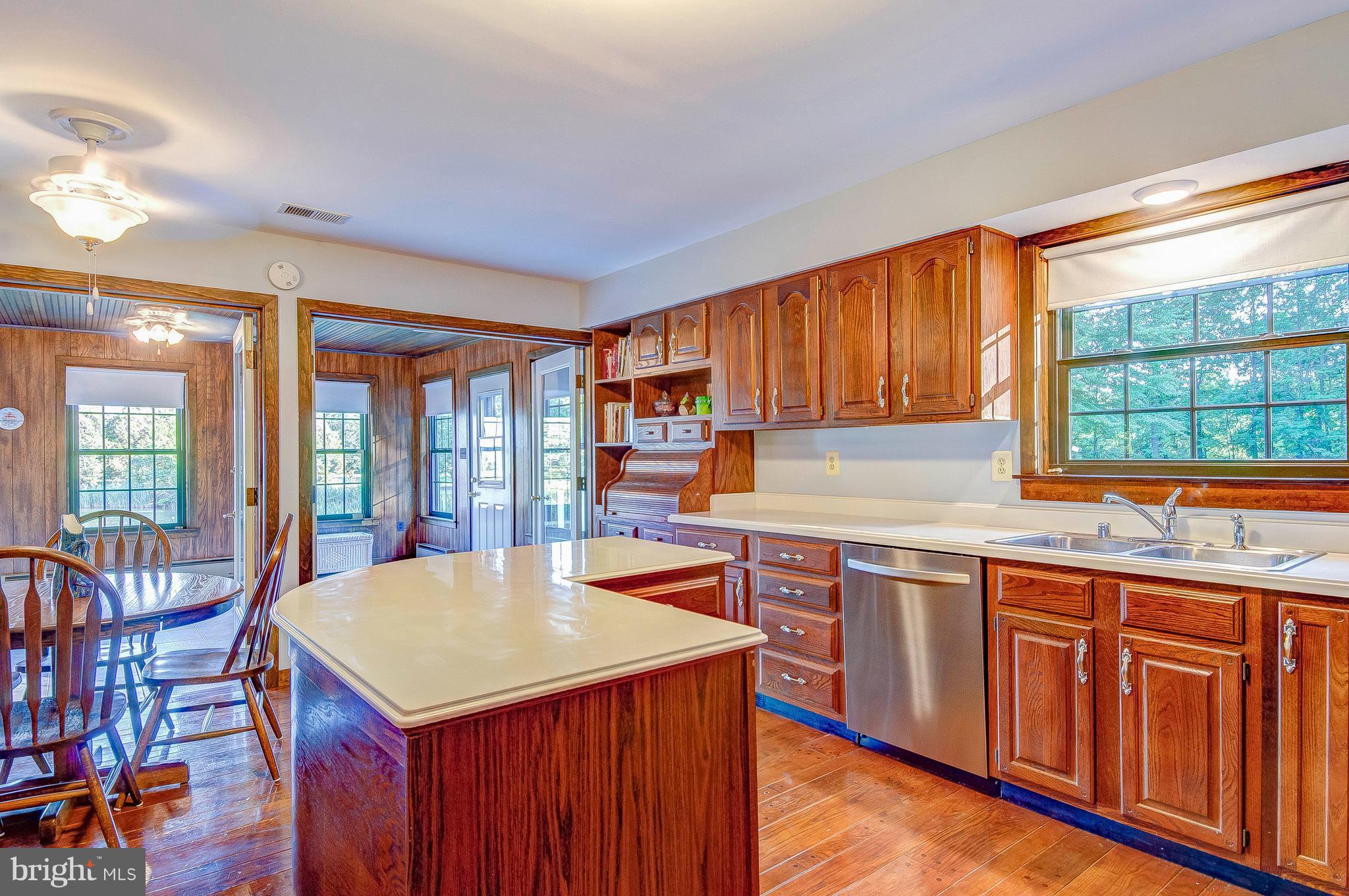 5966 Tyler Road Deale, MD 20751 - Photo 12 of 30 a kitchen with a sink stove and cabinets