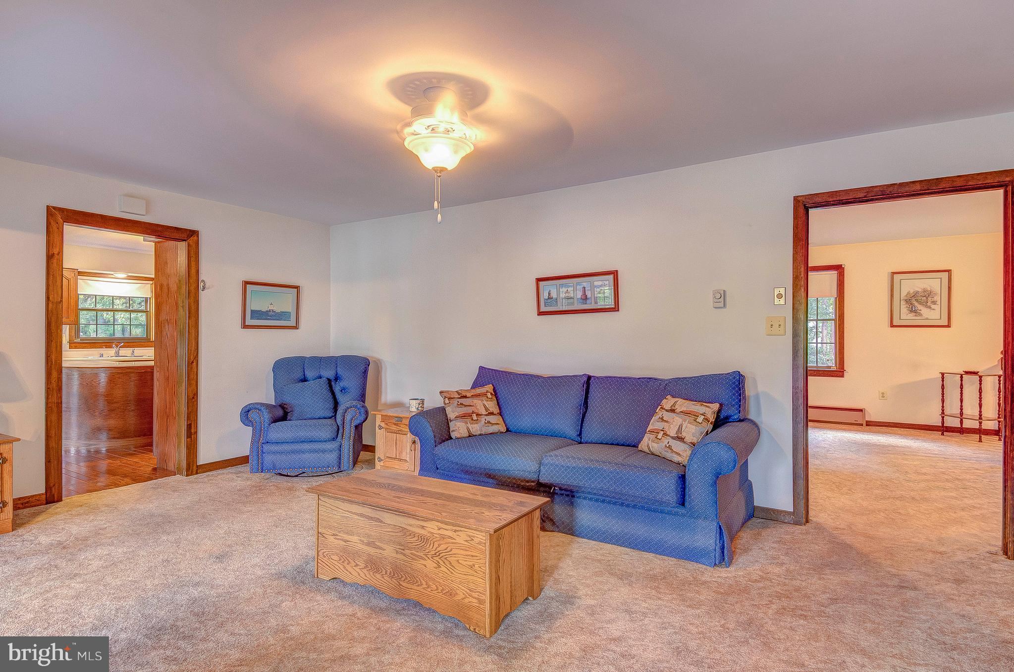 5966 Tyler Road Deale, MD 20751 - Photo 17 of 30 a living room with furniture and a chandelier