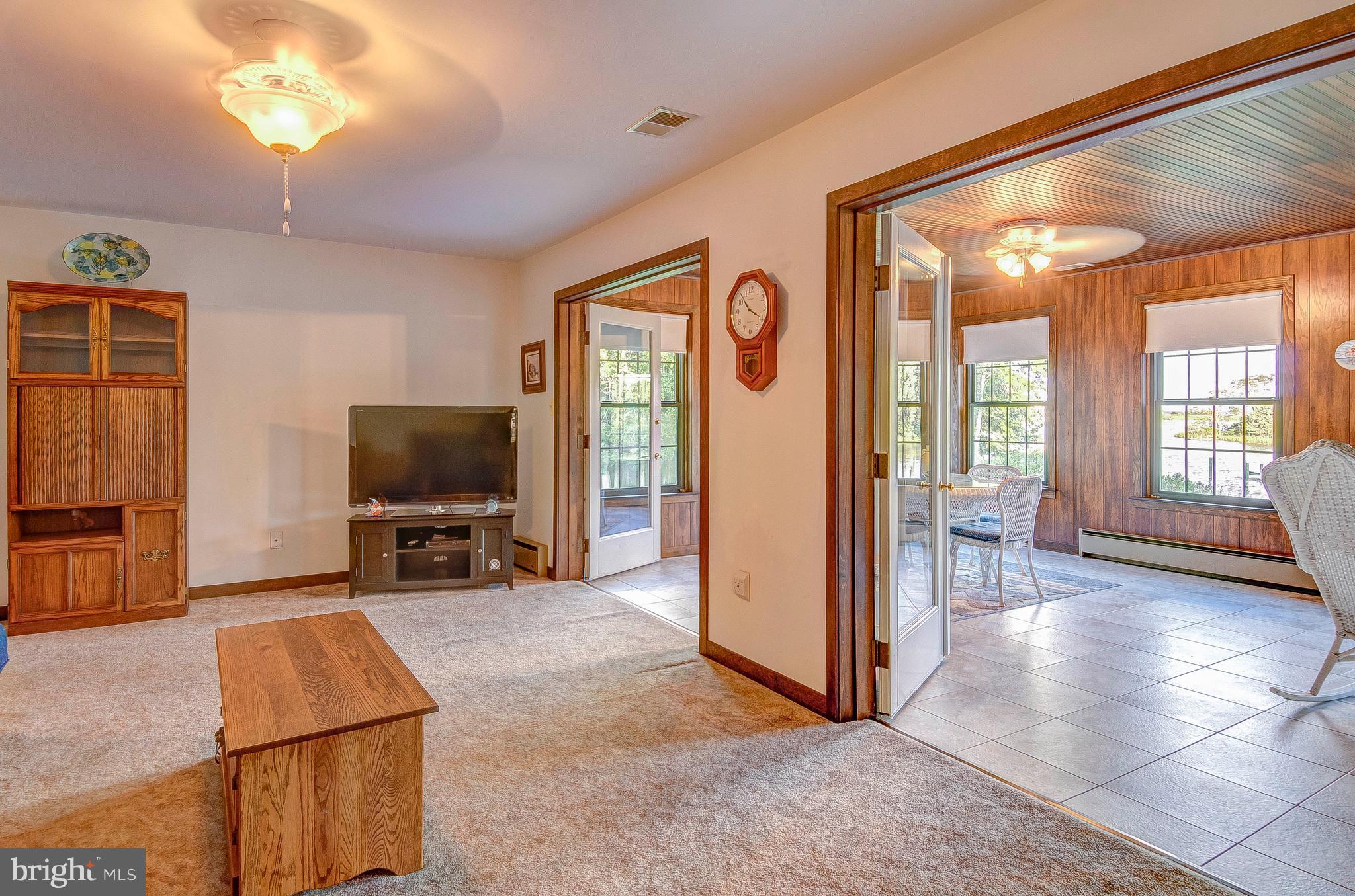 5966 Tyler Road Deale, MD 20751 - Photo 20 of 30 a view of a livingroom with furniture and a flat screen tv
