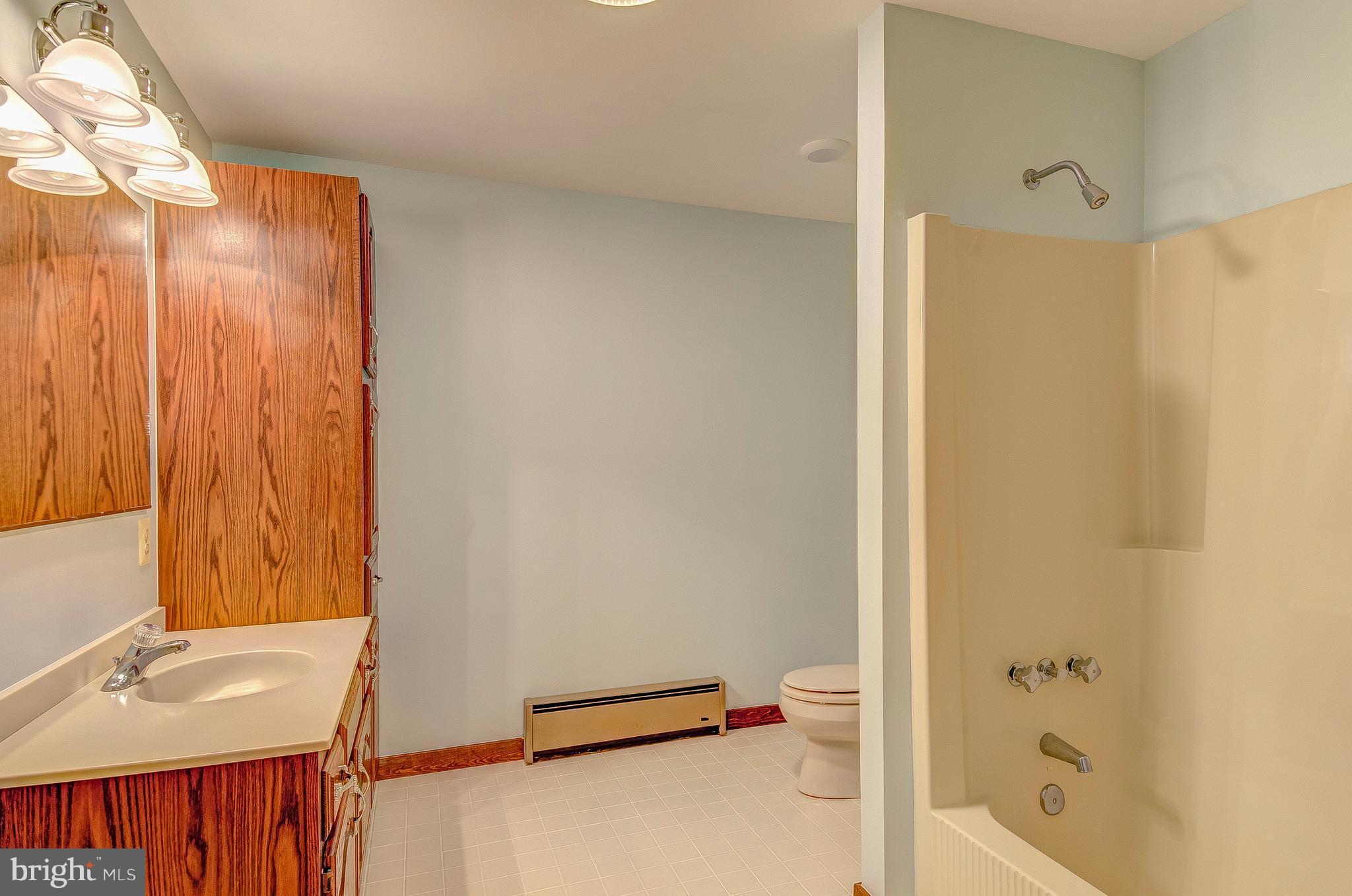 5966 Tyler Road Deale, MD 20751 - Photo 22 of 30 a bathroom with a tub and a sink