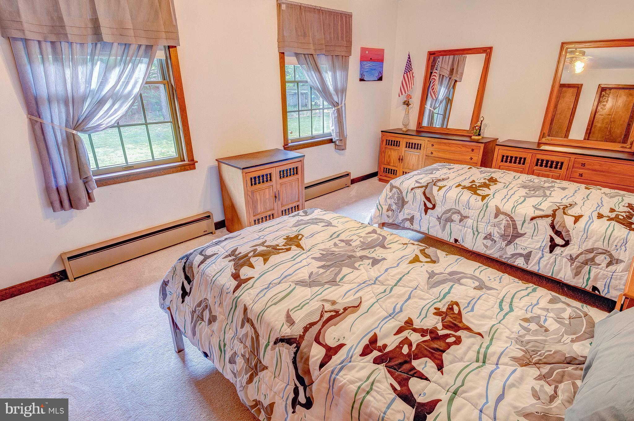 5966 Tyler Road Deale, MD 20751 - Photo 24 of 30 a bedroom with natural light and wooden floor