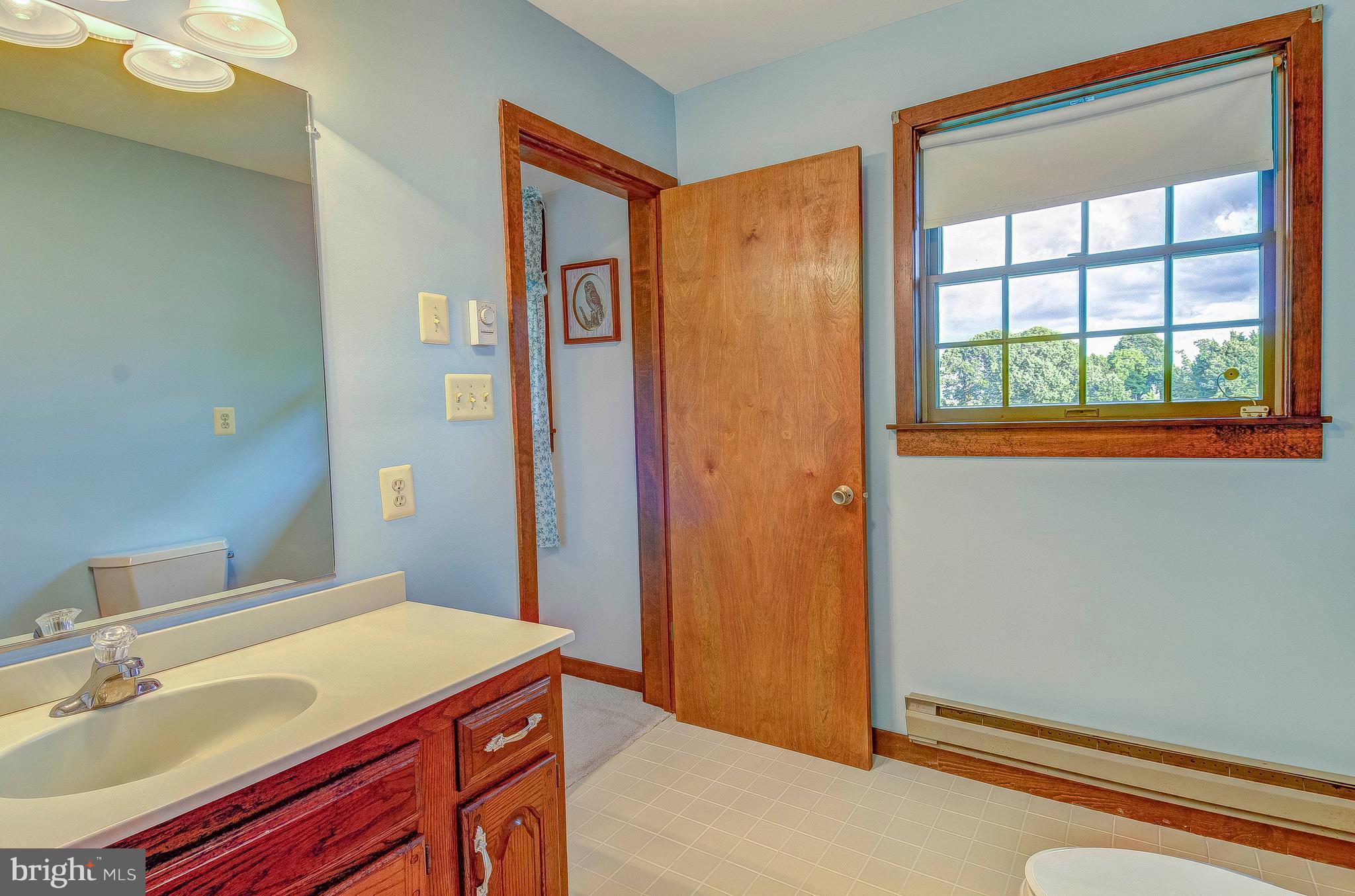 5966 Tyler Road Deale, MD 20751 - Photo 25 of 30 a bathroom with a sink and a mirror