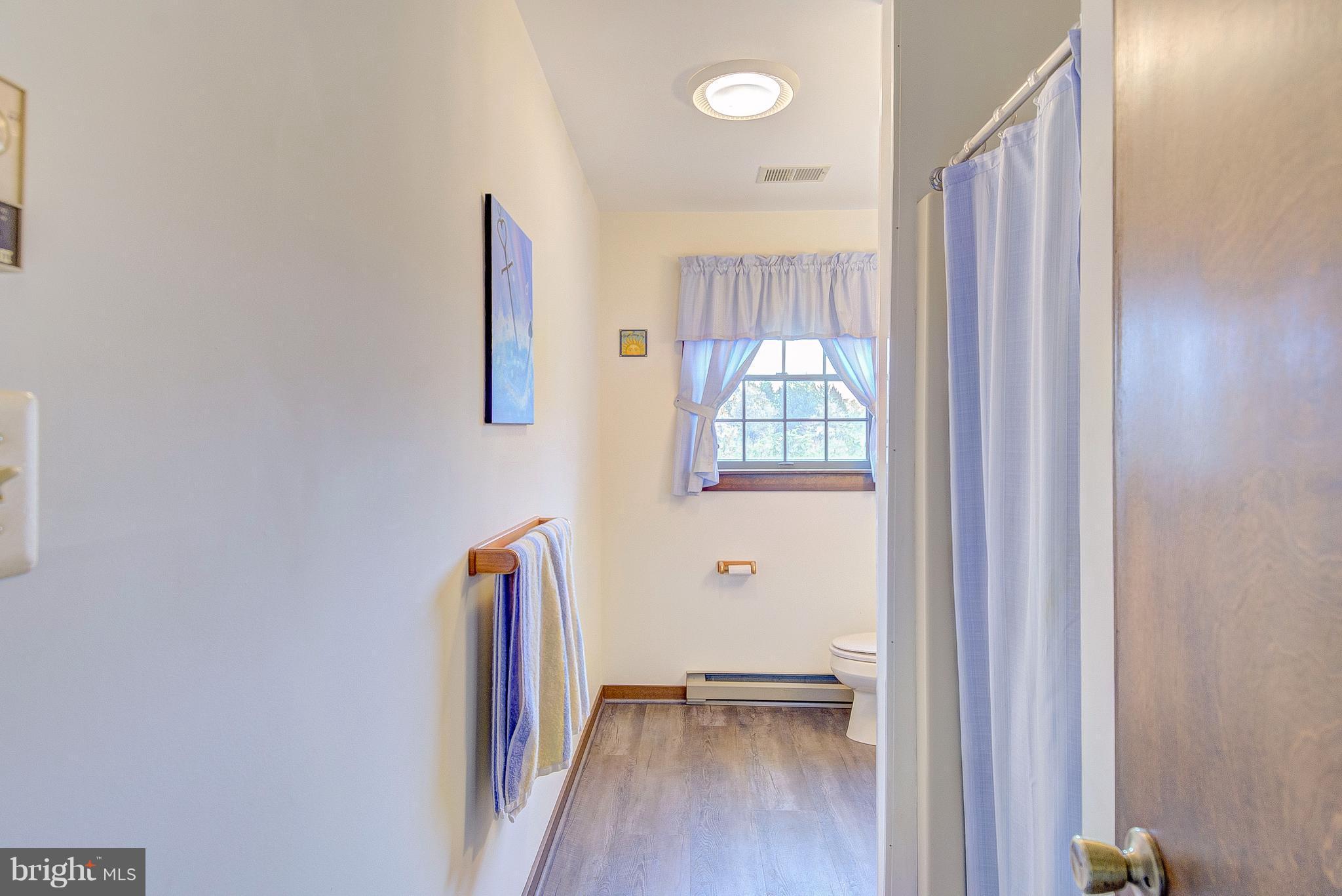 5966 Tyler Road Deale, MD 20751 - Photo 27 of 30 an entryway with wooden floor and a window