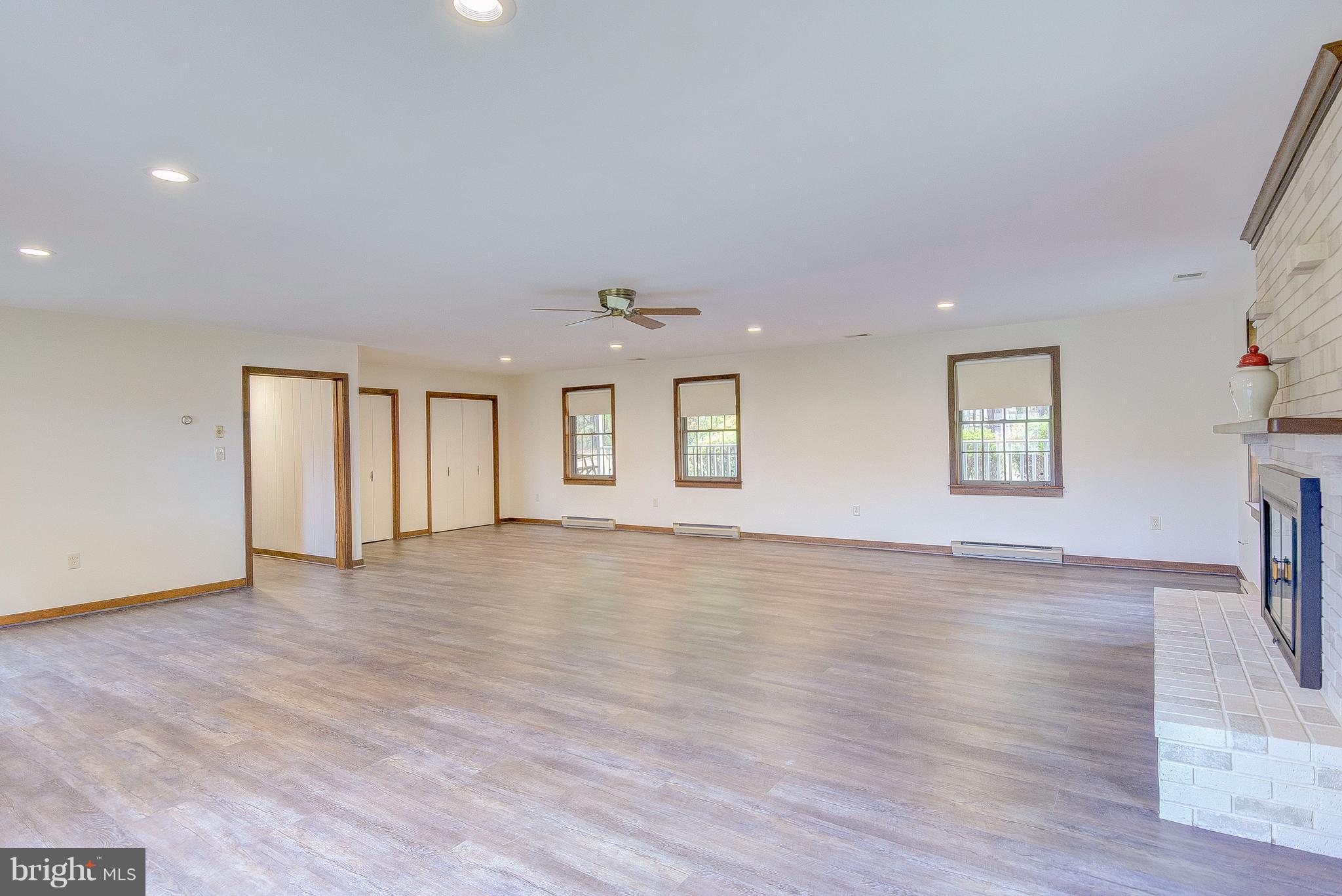 5966 Tyler Road Deale, MD 20751 - Photo 29 of 30 a view of an empty room with a window and wooden floor