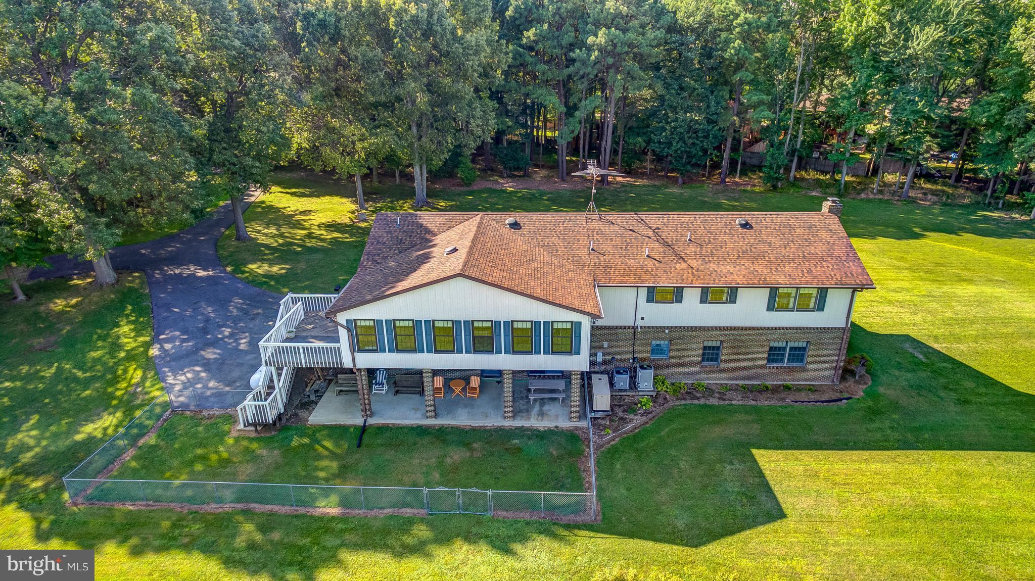 5966 Tyler Road Deale, MD 20751 - Photo 5 of 30 aerial view of a house with swimming pool lawn chairs and a yard