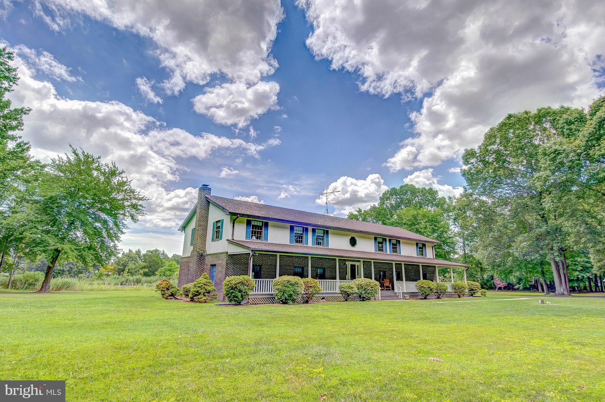 5966 Tyler Road Deale, MD 20751 - Photo 9 of 30 a front view of a house with a garden