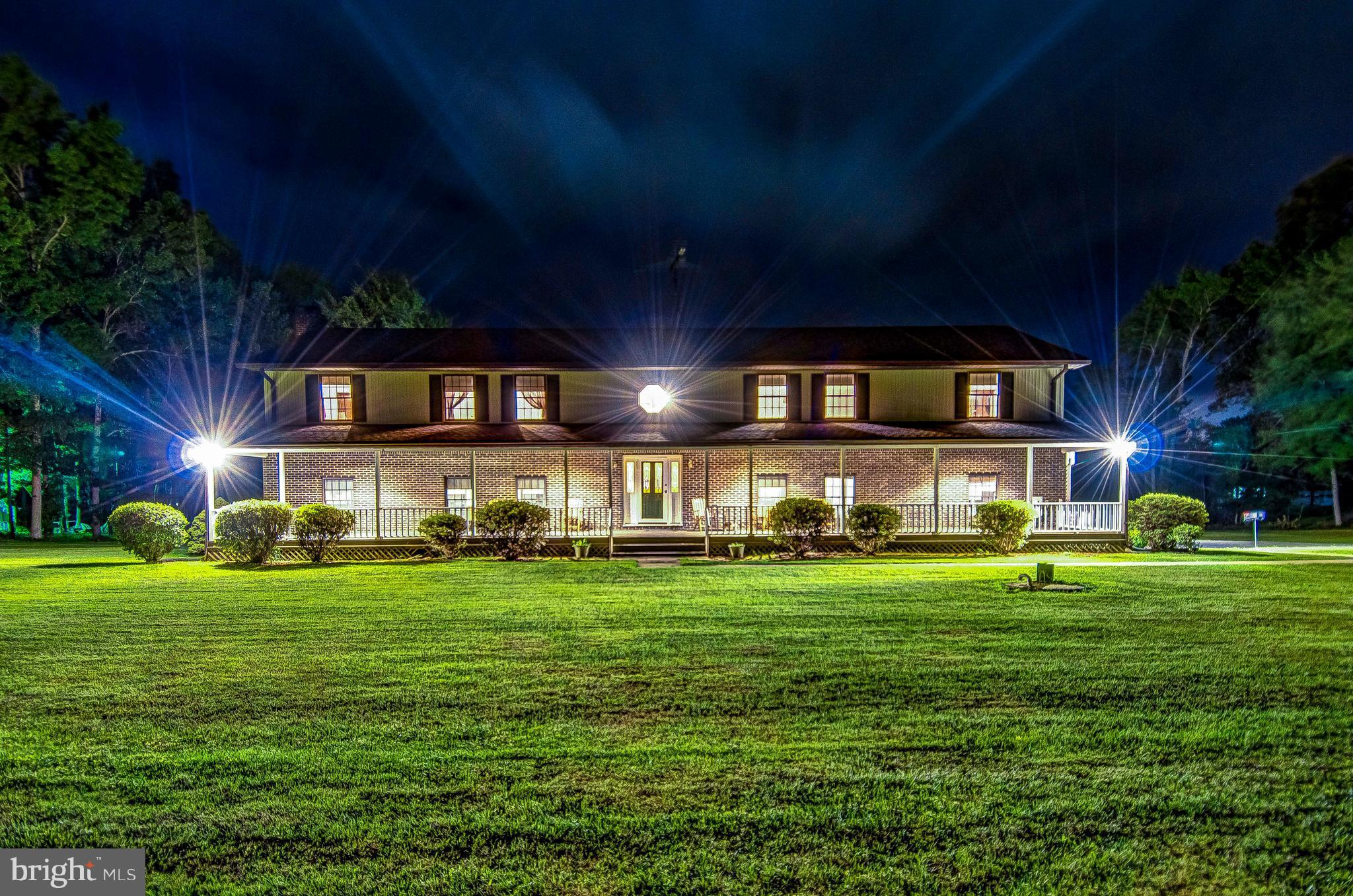 5966 Tyler Road Deale, MD 20751 - Photo 10 of 30 a view of a big building with big yard and large trees