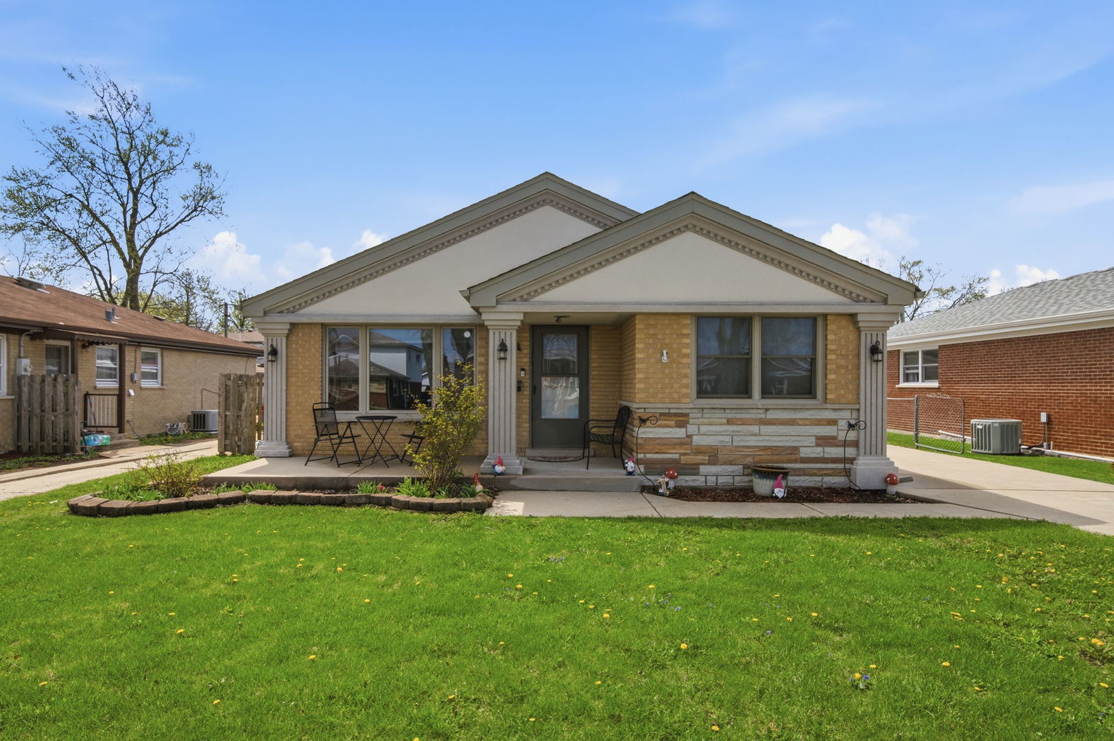 3813 153rd Street Midlothian, IL 60445 - Photo 16 of 18 a front view of a house with a yard and patio