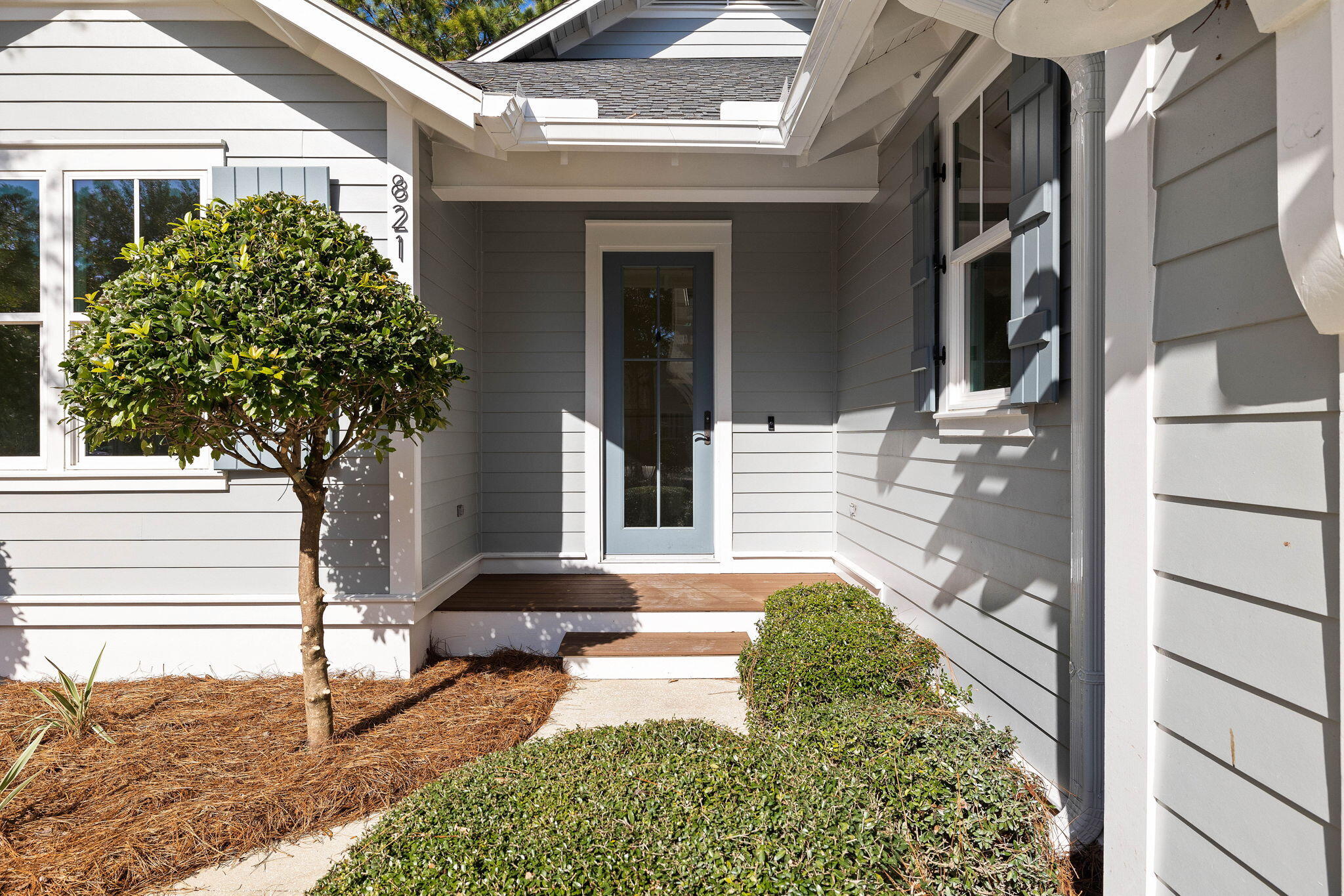 821 Breakers Street Inlet Beach, FL 32461 - Photo 12 of 69 a front view of a house with garden