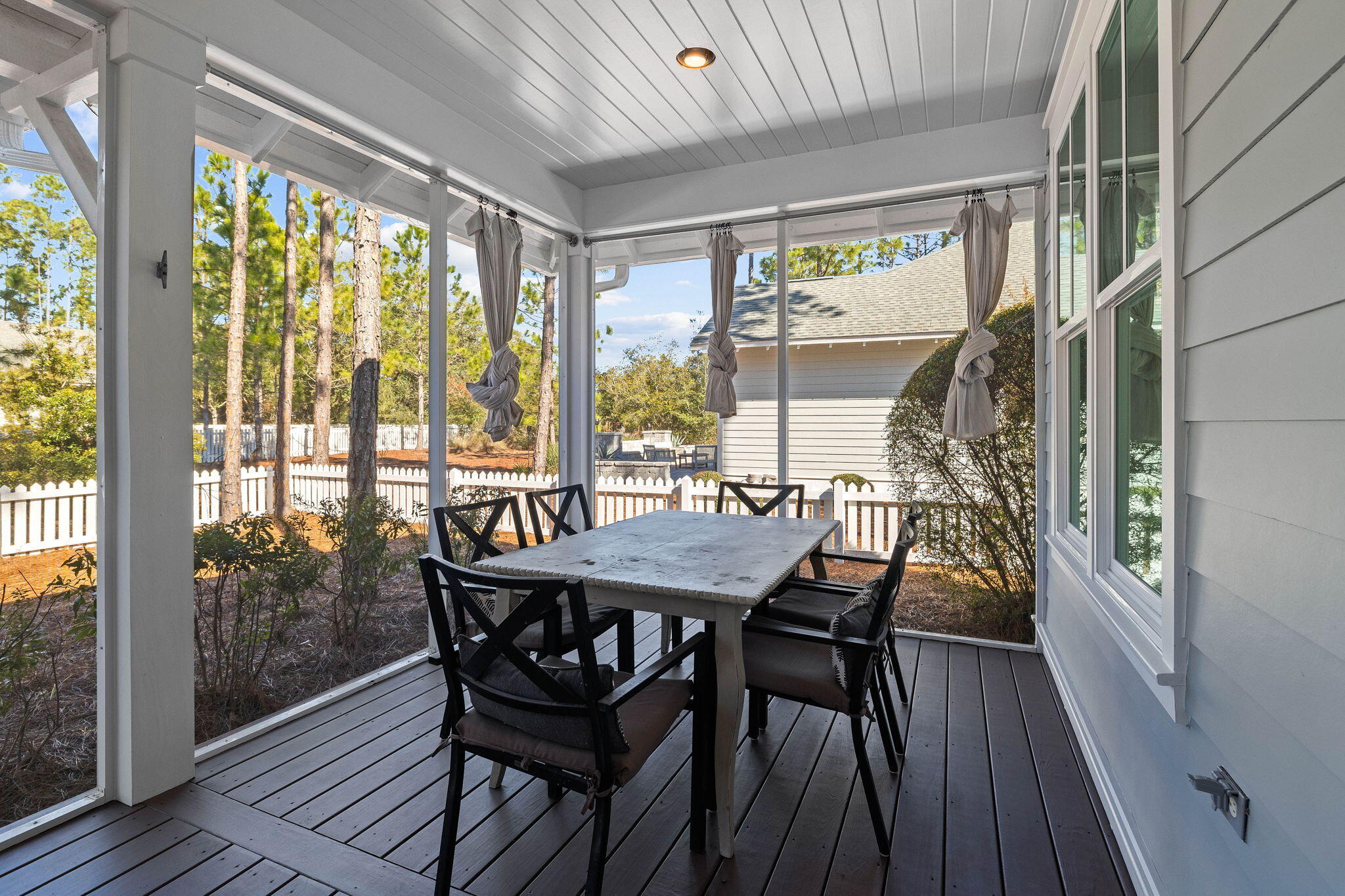 821 Breakers Street Inlet Beach, FL 32461 - Photo 26 of 69 a view of a dining room with furniture window and wooden floor