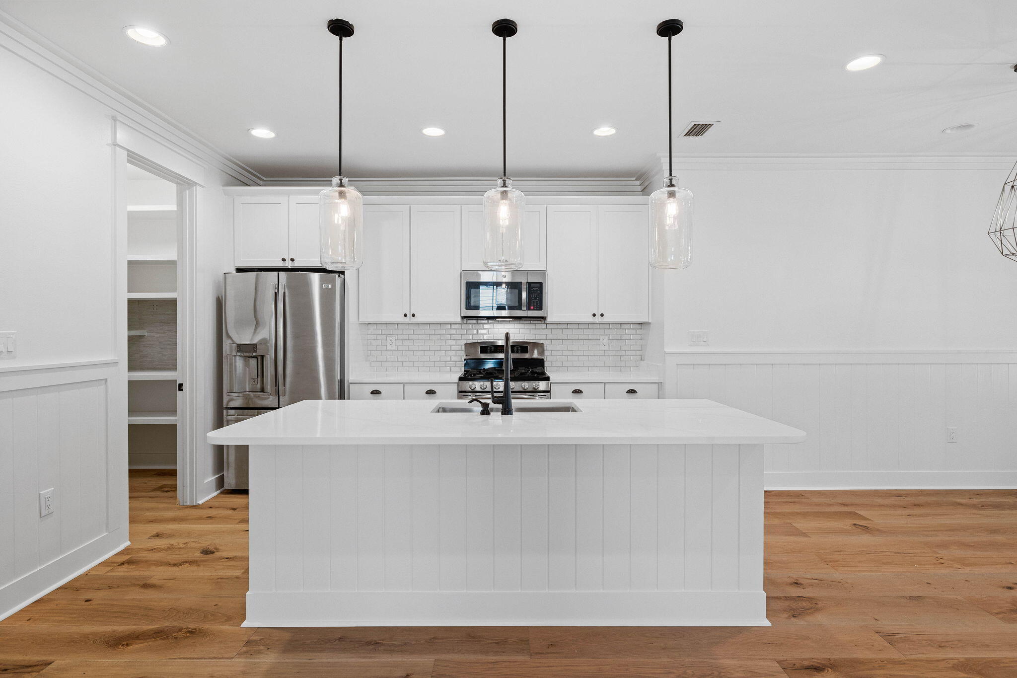 821 Breakers Street Inlet Beach, FL 32461 - Photo 29 of 69 a view of a kitchen with kitchen island a counter top space appliances and cabinets