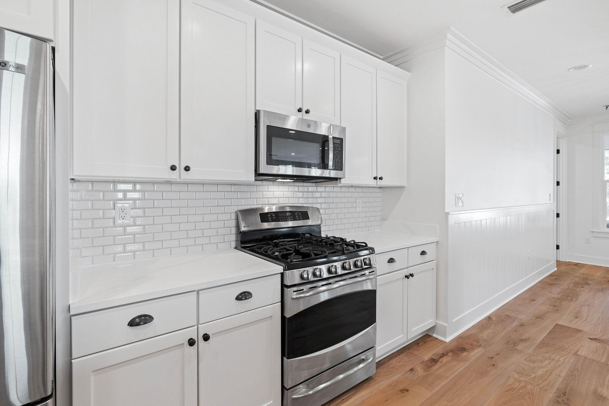 821 Breakers Street Inlet Beach, FL 32461 - Photo 32 of 69 a kitchen with granite countertop cabinets and steel stainless steel appliances