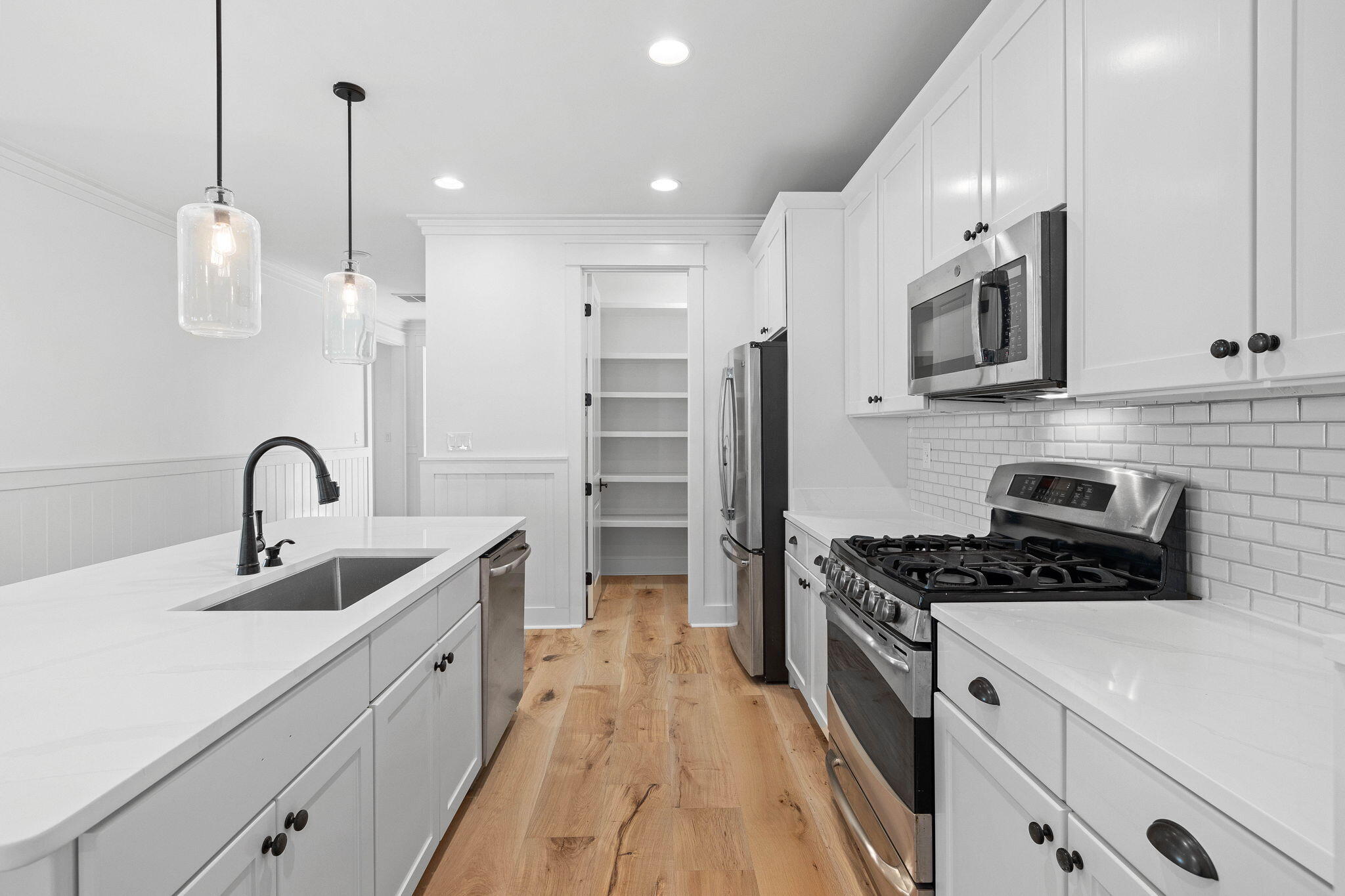 821 Breakers Street Inlet Beach, FL 32461 - Photo 33 of 69 a kitchen with stainless steel appliances a sink stove and refrigerator