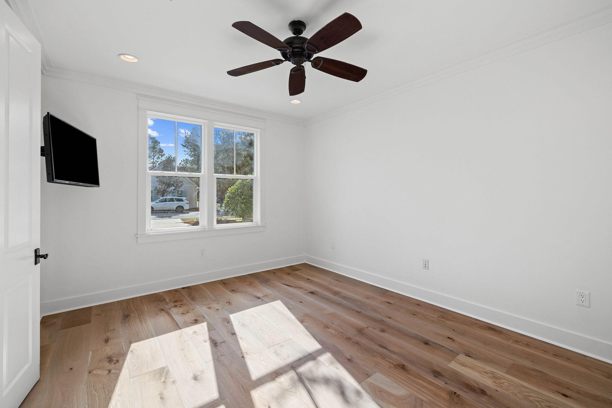 821 Breakers Street Inlet Beach, FL 32461 - Photo 40 of 69 wooden floor in an empty room with a window