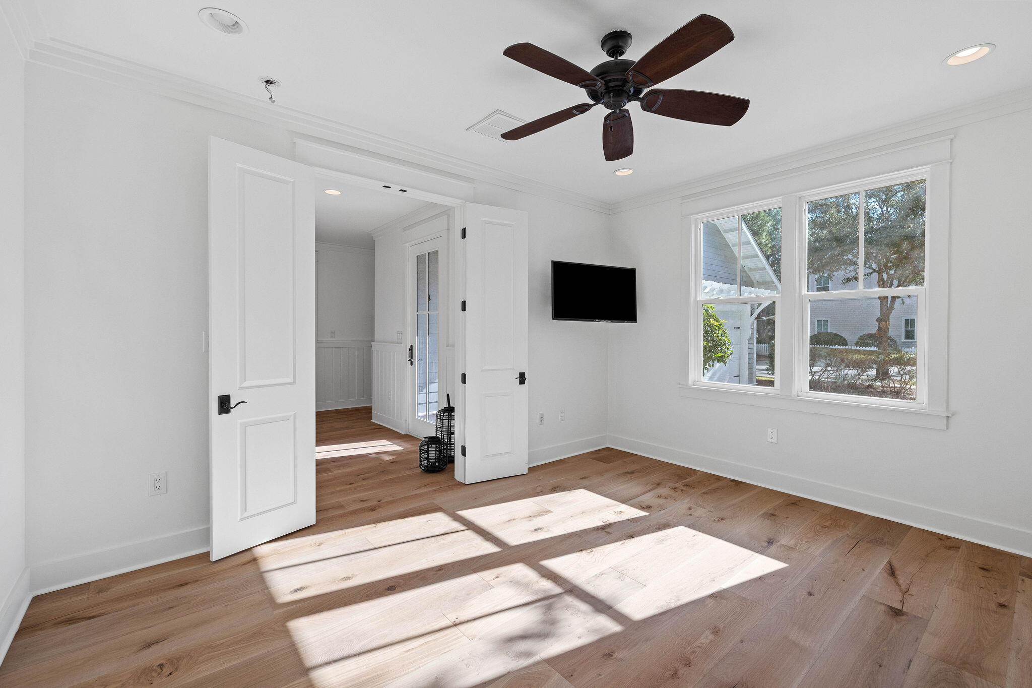 821 Breakers Street Inlet Beach, FL 32461 - Photo 41 of 69 a view of an empty room with wooden floor and a window